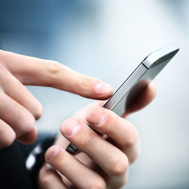 Close-up of hands holding a smartphone