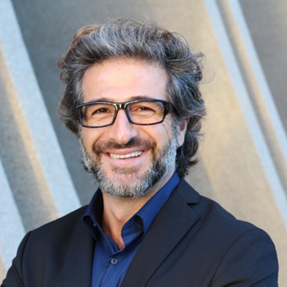 Senior man with glasses smiling
