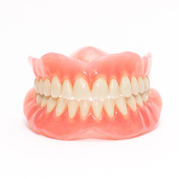 Close-up of full dentures in Reynoldsburg on white background